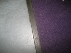 Rubber tape on the edge of the carpet